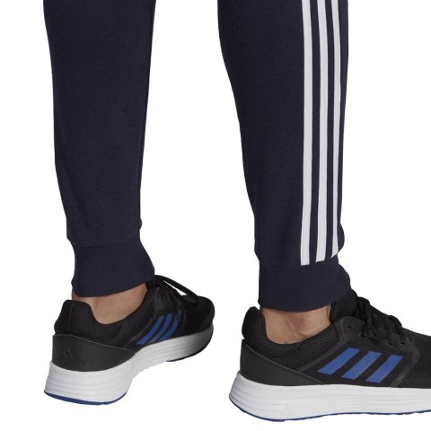 Spodnie męskie adidas Essentials Slim 3 Stripes Pants granatowe GM1090 Spodnie męskie adidas Essentials Slim 3 Stripes Pants granatowe GM1090