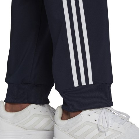 Spodnie męskie adidas Essentials Tapered Cuff 3 Stripes Pants granatowe GK8981