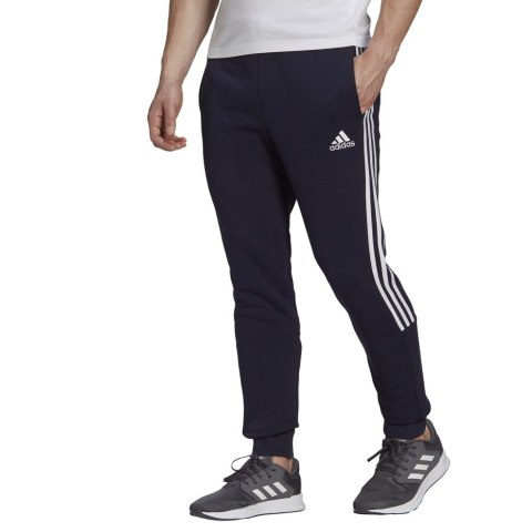 Spodnie męskie adidas Essentials Tapered Cuff 3 Stripes granatowe GK8977 Spodnie męskie adidas Essentials Tapered Cuff 3 Stripes granatowe GK8977
