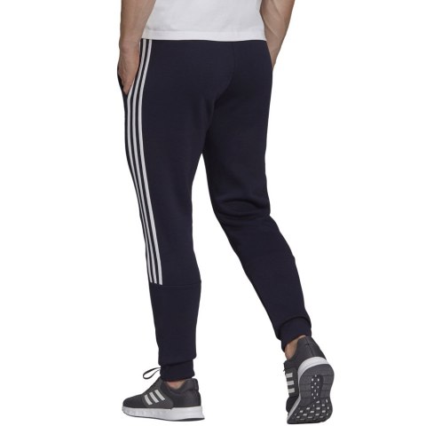 Spodnie męskie adidas Essentials Tapered Cuff 3 Stripes granatowe GK8977 Spodnie męskie adidas Essentials Tapered Cuff 3 Stripes granatowe GK8977