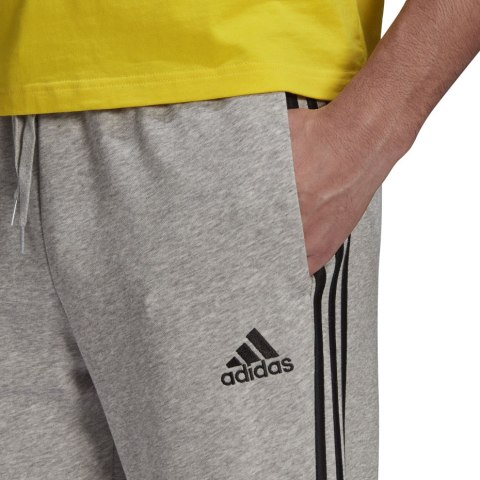 Spodnie męskie adidas Essentials Tapered Cuff 3 Stripes szare GK8889 Spodnie męskie adidas Essentials Tapered Cuff 3 Stripes szare GK8889