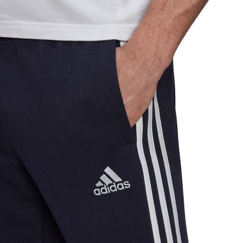 Spodnie męskie adidas Essentials Tapered Elastic Cuff 3 Stripes Pant granatowe GK8830 Spodnie męskie adidas Essentials Tapered Elastic Cuff 3 Stripes Pant granatowe GK8830