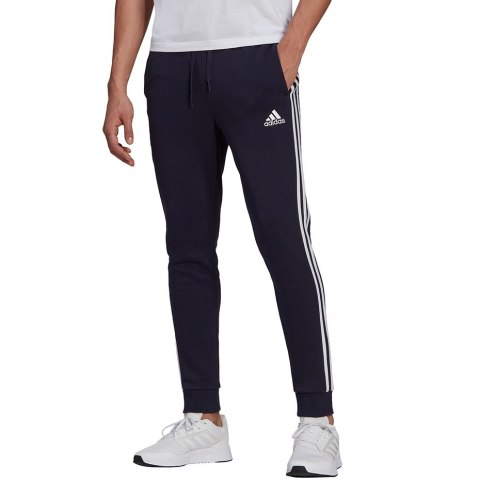 Spodnie męskie adidas Essentials Fleece Tapered Cuff 3-Band Pants granatowe GK8823 Spodnie męskie adidas Essentials Fleece Tapered Cuff 3-Band Pants granatowe GK8823