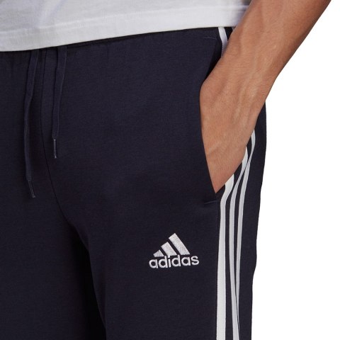 Spodnie męskie adidas Essentials Fleece Tapered Cuff 3-Band Pants granatowe GK8823 Spodnie męskie adidas Essentials Fleece Tapered Cuff 3-Band Pants granatowe GK8823