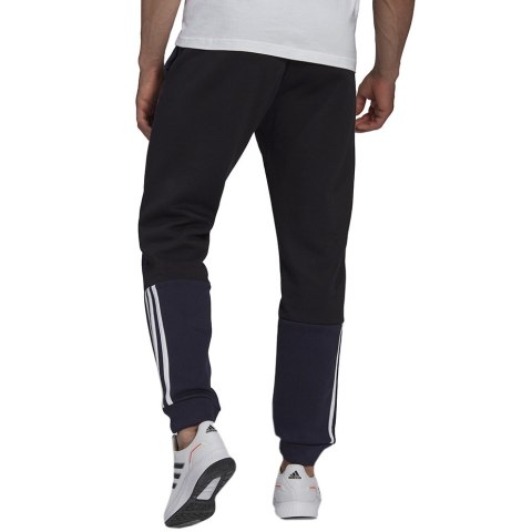 Spodnie męskie adidas Essentials Colorblock Fleece granatowe HK2884 Spodnie męskie adidas Essentials Colorblock Fleece granatowe HK2884