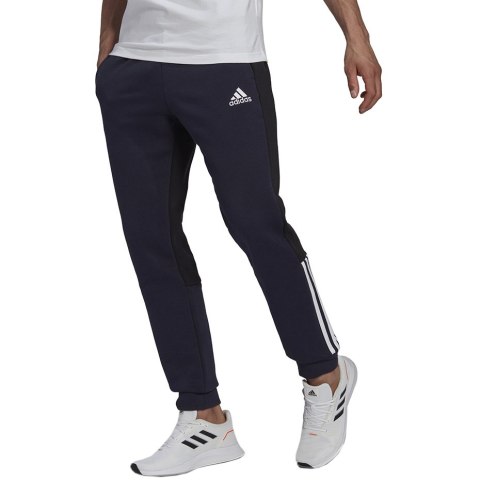Spodnie męskie adidas Essentials Colorblock Fleece granatowe HK2884 Spodnie męskie adidas Essentials Colorblock Fleece granatowe HK2884