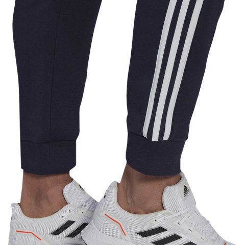 Spodnie męskie adidas Essentials Colorblock Fleece granatowe HK2884 Spodnie męskie adidas Essentials Colorblock Fleece granatowe HK2884