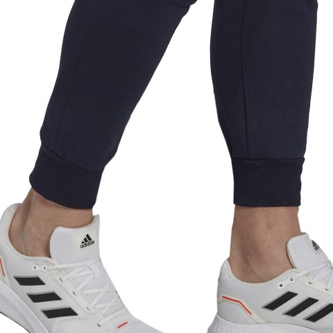 Spodnie męskie adidas Essentials Fleece Regular Tapered granatowe HL2231 Spodnie męskie adidas Essentials Fleece Regular Tapered granatowe HL2231