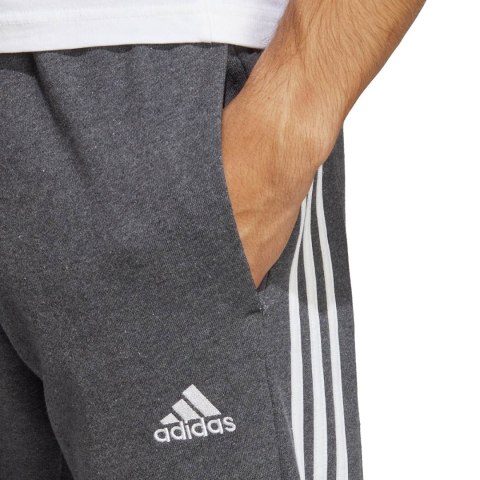 Spodnie męskie adidas Essentials French Terry Tapered Cuff 3-Stripes szare IC9408 Spodnie męskie adidas Essentials French Terry Tapered Cuff 3-Stripes szare IC9408