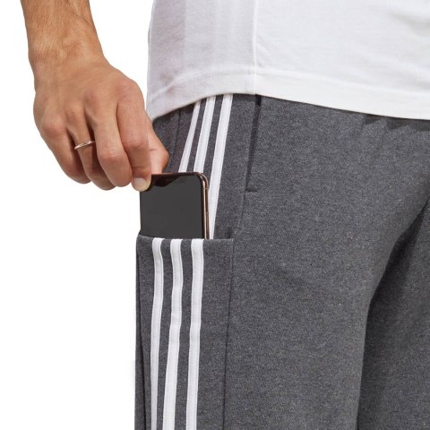 Spodnie męskie adidas Essentials French Terry Tapered Cuff 3-Stripes szare IC9408 Spodnie męskie adidas Essentials French Terry Tapered Cuff 3-Stripes szare IC9408