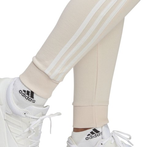Spodnie damskie adidas Essentials 3-Stripes French Terry Cuffed kremowe IC9924 Spodnie damskie adidas Essentials 3-Stripes French Terry Cuffed kremowe IC9924