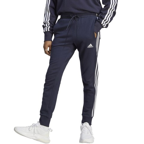 Spodnie męskie adidas Essentials French Terry Tapered Cuff 3-Stripes granatowe IC9406 Spodnie męskie adidas Essentials French Terry Tapered Cuff 3-Stripes granatowe IC9406