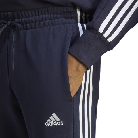 Spodnie męskie adidas Essentials French Terry Tapered Cuff 3-Stripes granatowe IC9406 Spodnie męskie adidas Essentials French Terry Tapered Cuff 3-Stripes granatowe IC9406