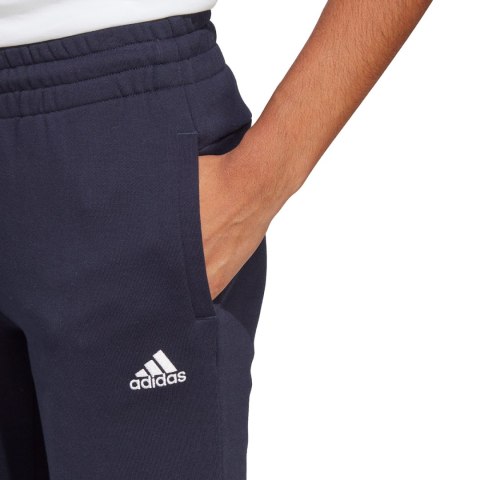 Spodnie damskie adidas Essentials Linear French Terry Cuffed granatowe IC6869 Spodnie damskie adidas Essentials Linear French Terry Cuffed granatowe IC6869
