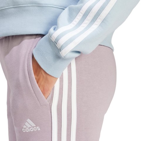 Spodnie damskie adidas Essentials 3-Stripes Fleece fioletowe IR5403 Spodnie damskie adidas Essentials 3-Stripes Fleece fioletowe IR5403