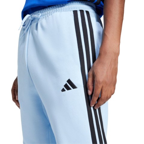 Spodnie męskie adidas Essentials 3-Stripes Fleece błękitne JE6315 Spodnie męskie adidas Essentials 3-Stripes Fleece błękitne JE6315