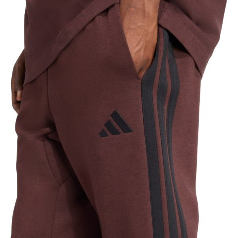 Spodnie męskie adidas Essentials 3-Stripes Fleece brązowe JX0749